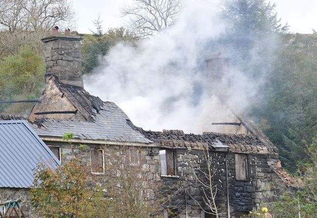 Smoke billows from the collapsed Rhiw Goch Inn roof in Trawsfynydd