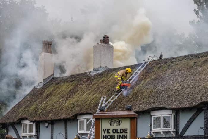 Firefighters tackle the blaze at Ye Olde Hob Inn.