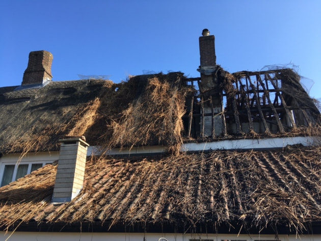 Fire ripped through the thatch at one end of the farmhouse leaving the beams totally exposed. 