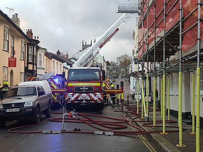 Firefighters use an aerial platform to tackle the fire 