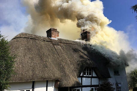 The thatched roof was fully alight when crews arrived 