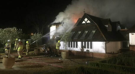 Six fire crews from two counties were sent to tackle a massive blaze at a thatched home in Goring.