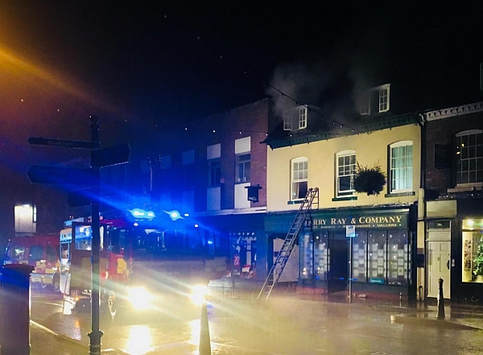 Smoke can be seen from the second floor in the early hours of the morning.