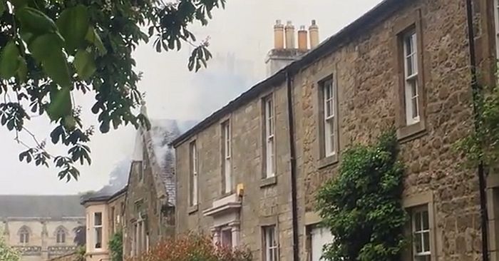 Smoke visible from the roof of the listed building at The Sands