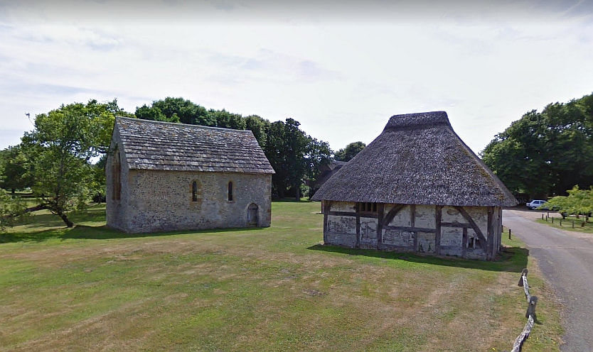 The thatched outbuilding next to the chapel