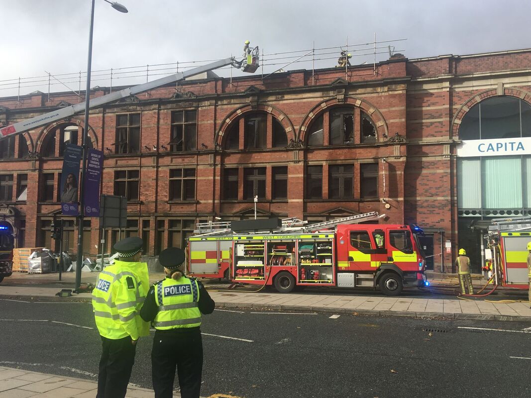 Fire fighters at the scene of fire at Capita building on Clay Pit Lane in Leeds