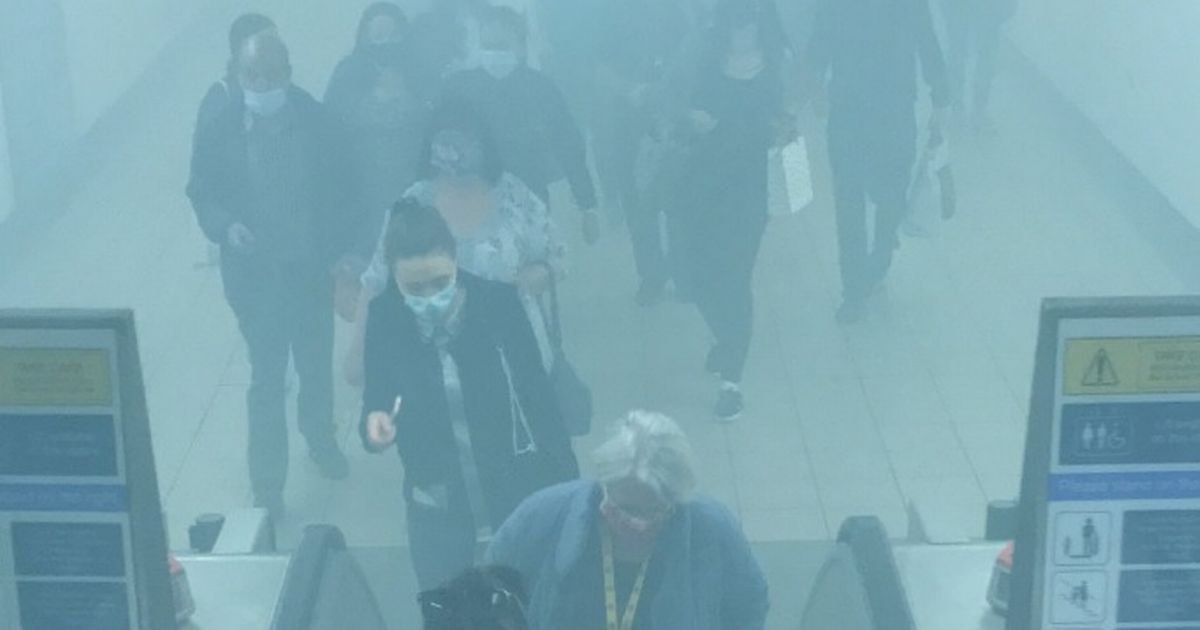 Smoke billowing up the escalators in Liverpool Central