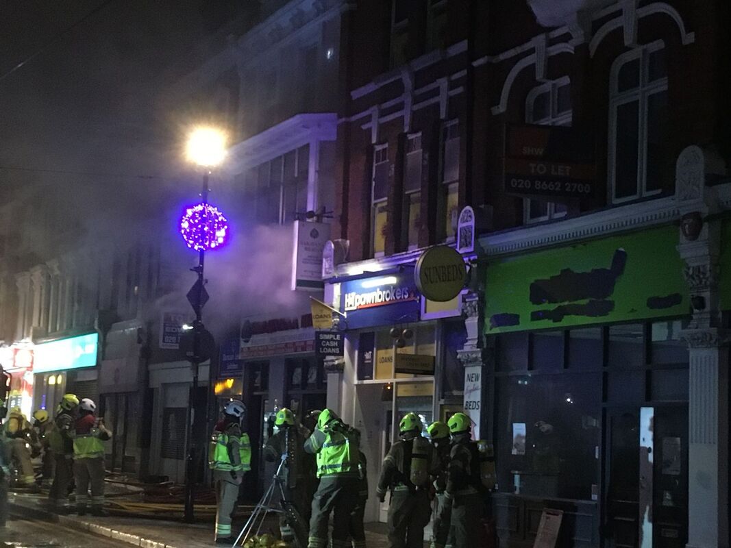 Fire crews work in 'difficult conditions' tackling a restaurant blaze on George Street, Croydon which spread to higher floors
