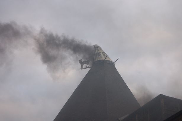 Smoke billows from the top of the old maltings building in Burton (Image: Simon Elson)
