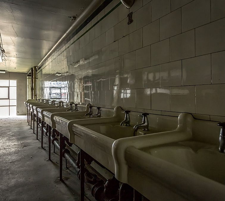 Rows of sinks from seminary dorms