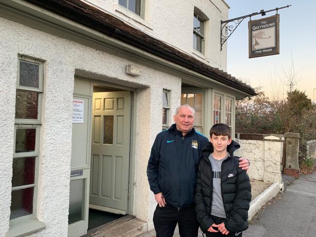 Keith Morris with his son Jack, 13, who were rescued from the roof as the pub was on fire
