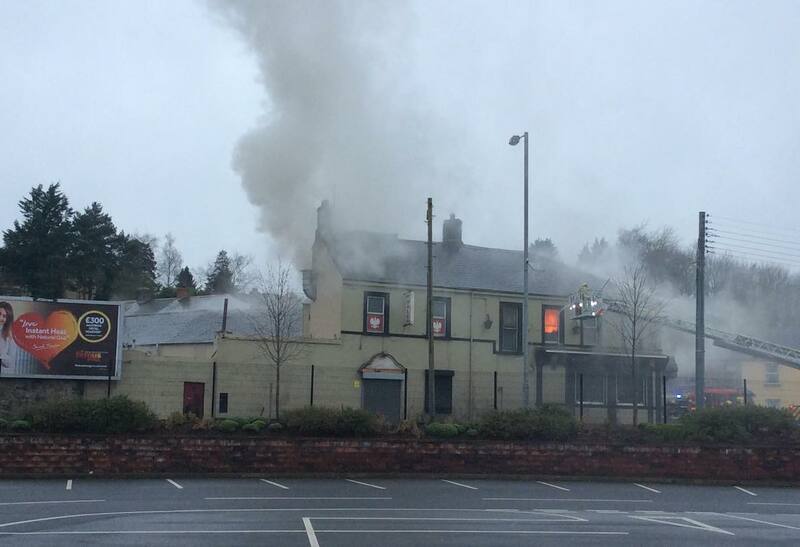 Firefighters tackle the blaze at the historic pub