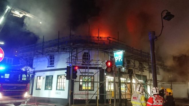Flames from fire could be seen coming out of the roof of the building