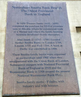 The commemorative plaque on the wall