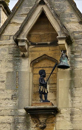 The Black Boy striking the bell