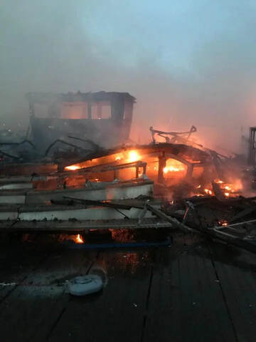 Charred ruins showed where the fire roared through the pier (Credit: Twitter/@Sth_Shore_Fire)