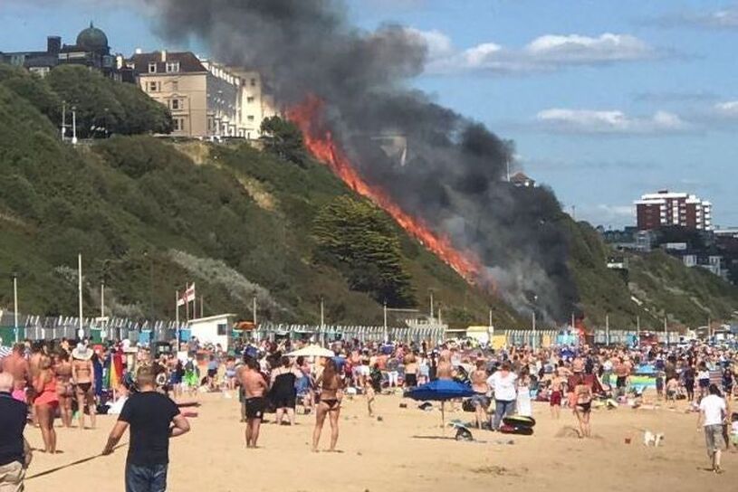 Sunseekers watched on in horror as the inferno ripped up a steep hill