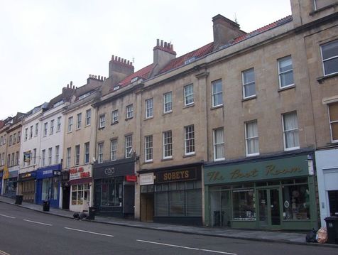 The terrace of 6 buildings is Grade II listed as a group (22 – 32), 