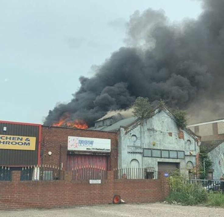 Smoke rises from the building during the intense blaze. (Picture: Jake Jones)