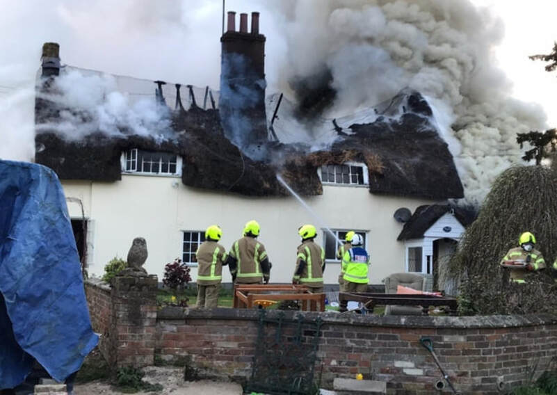 Firefighters at the scene of a large thatched farmhouse blaze (Picture: SUFFOLK FIRE AND RESCUE SERVICE)