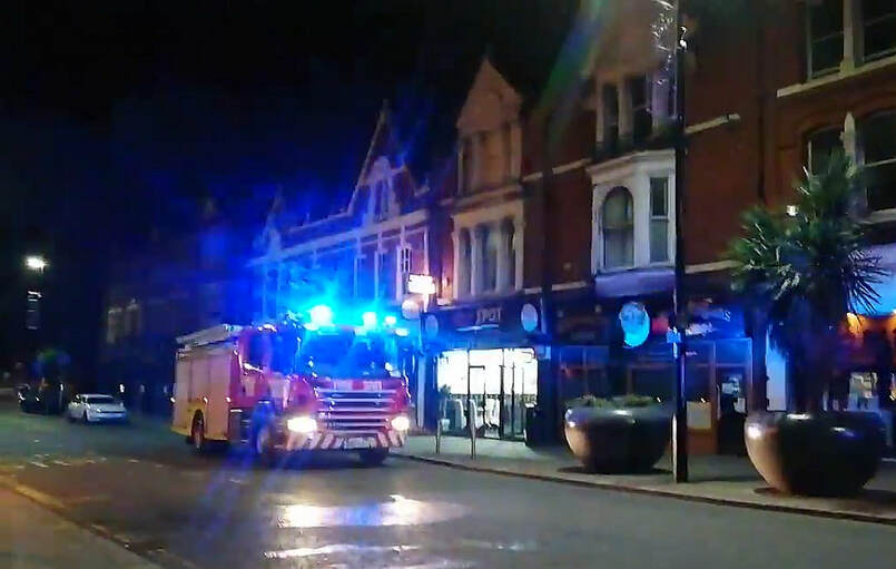 Firefighters outside the building in Warrington