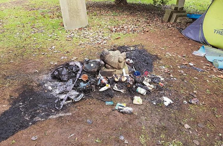 Some of the damage caused by the lighting of fires in the graveyard.