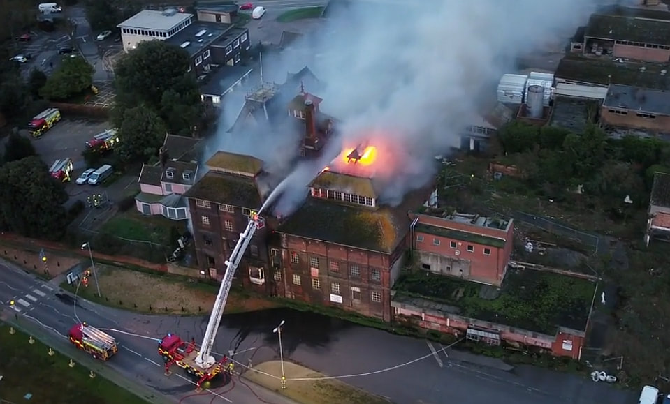 Firefighters on a turntable ladder tackle the flames Picture: (Sky Cam East)