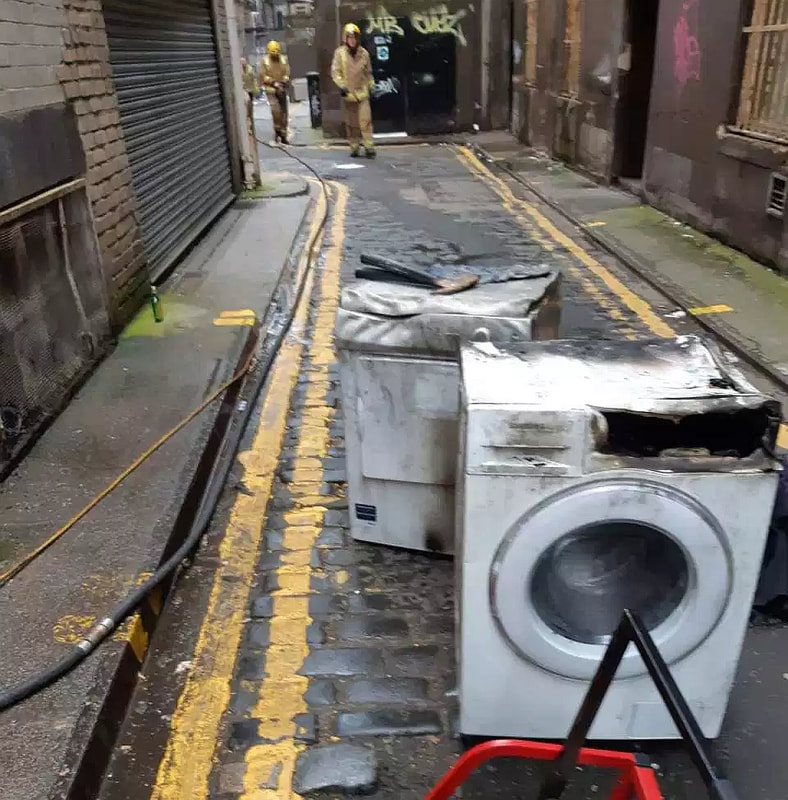 Two washing machines appear to be burned out